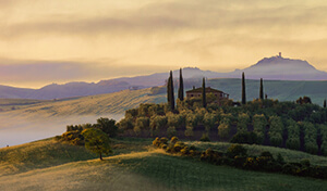 Rolling hills and cypress trees in the Tuscan countryside